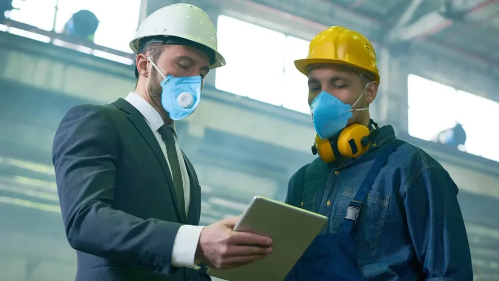 two covid inspectors wearing masks